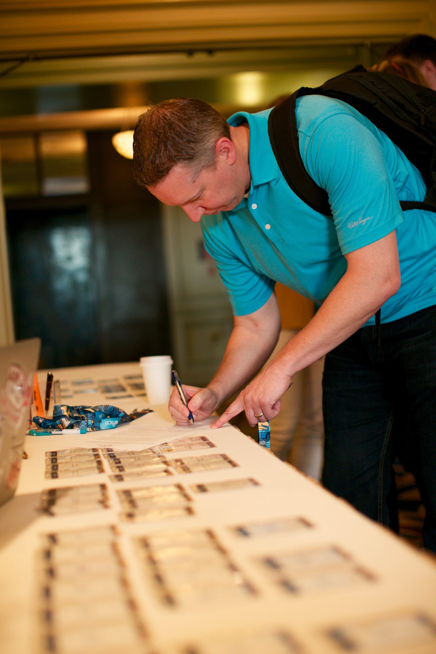 Customers check in to receive their name badges at ELEVATE